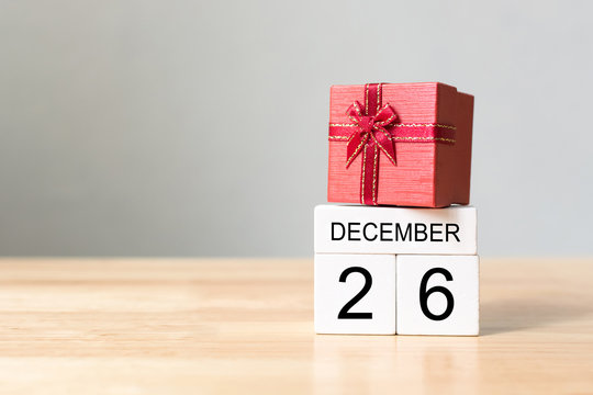 Image of a red present atop of a calendar that reads December 26th