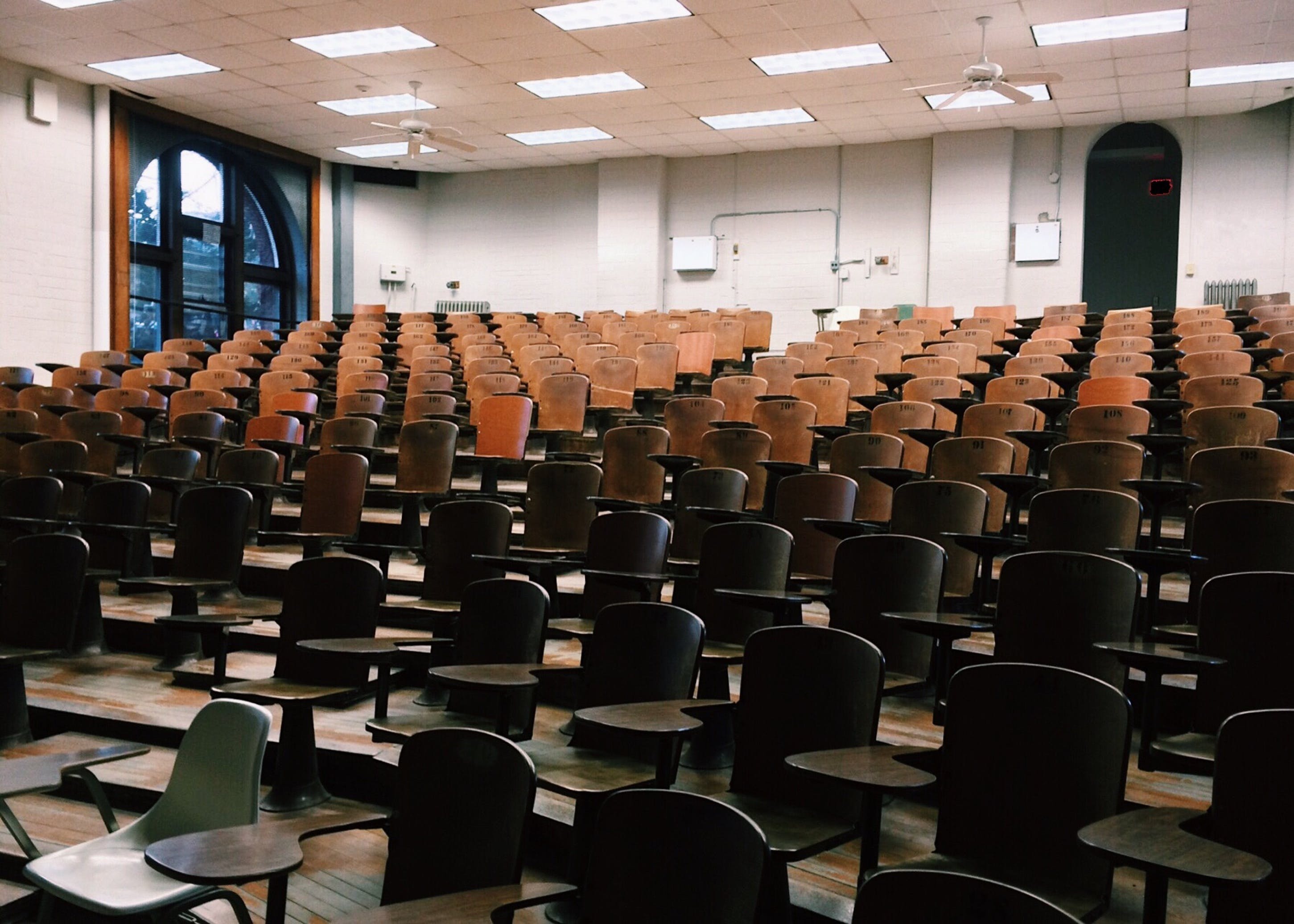 University lecture hall with rows of chairs